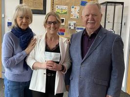 Presenting cheque to CNR Primary Academy